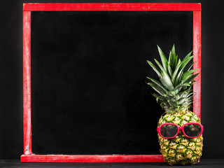pineapple and text on a school board