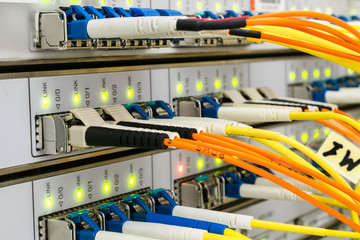  The network cables are connected to the main server. The front panel of the supercomputer located in the server room of the data center. The optical wires are connected to the central router.  