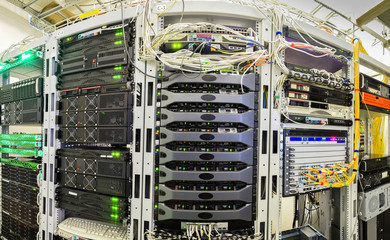 Panorama of the server room of the data center. A lot of powerful supercomputers working