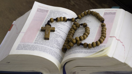my help in being good - cross from wooden rosary on the polish bible