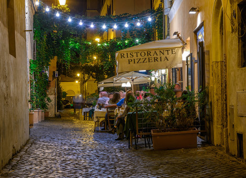 Fototapeta Night view of old street in Trastevere in Rome, Italy