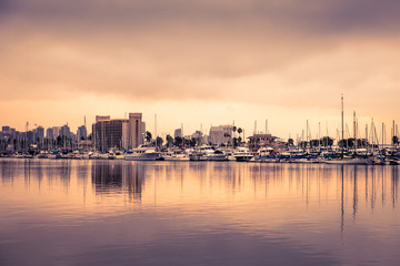 View of beautiful San Diego California with boats, sunset and buildings.