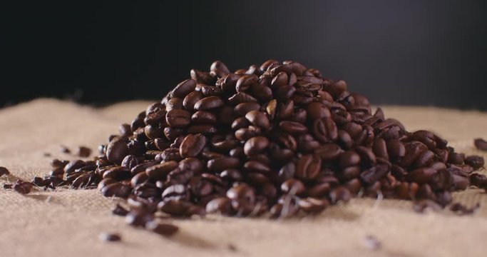 Heap Of Roasted Coffee Beans On Hessian Sack 4K