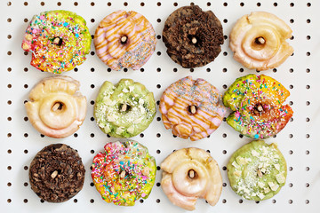 Variety of donuts on a peg board