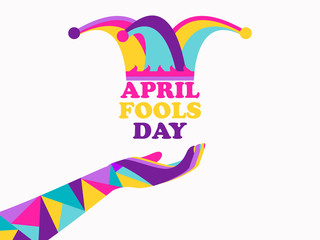 April Fools Day. Jester hat and hand from polygons. Colorful design. Vector illustration