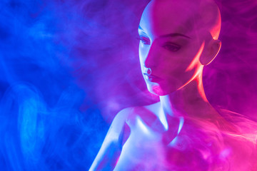 Bald girl. Dummy. Plastic woman in the smoke. The head of a female mannequin. Female mannequin.