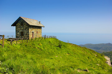 Fototapeta na wymiar Alpine landscape panorama with refuge cabin in Beigua National Geopark, Liguria, Italy