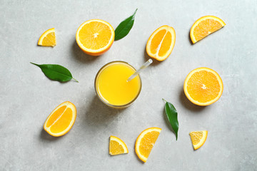 Glass of orange juice and fresh fruits on table, top view