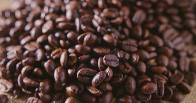 Closeup Of Roasted Coffee Beans On Hessian Sack 4K