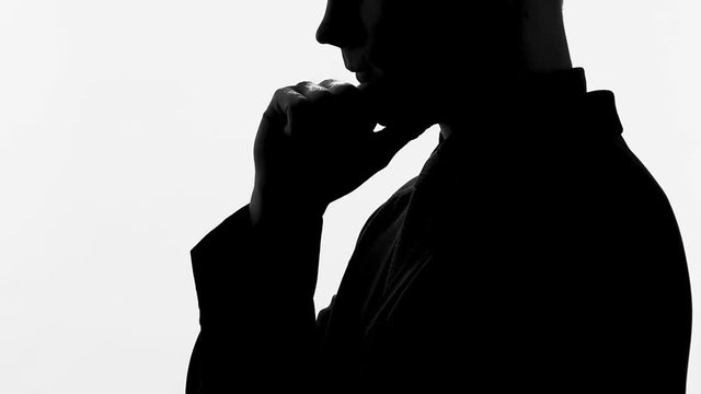 Male in black suit thinking about new business project, career and start-up