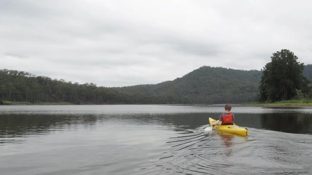 Man kayaking on river in Kangaroo Valley Australia