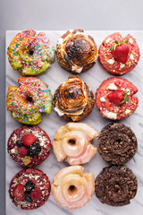 Variety of donuts on a marble surface