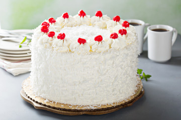 Coconut cake with maraschino cherries
