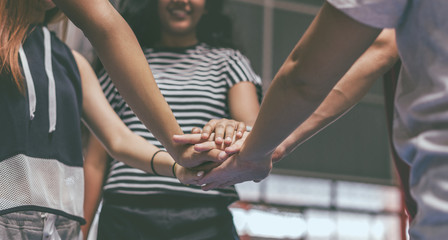 Group of teenager friends on a basketball court teamwork and togetherness concept