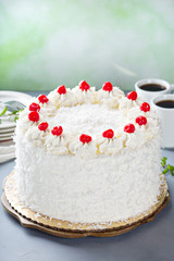 Coconut cake with maraschino cherries