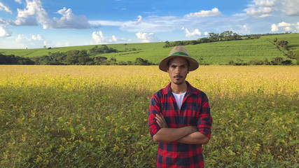 Farmer in soybean field plantation