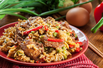 Fried rice with chicken and vegetables served on a plate