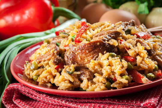 Fried rice with chicken and vegetables served on a plate