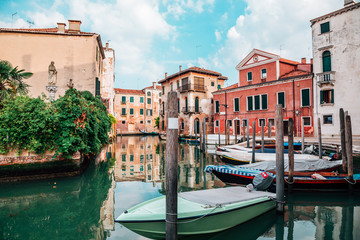 Fototapeta na wymiar European old buildings with canal in Venice, Italy