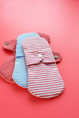 cloth menstrual pad on pink background.