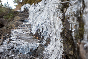 Fototapeta na wymiar Thick Ice on Narrow Hiking Trail