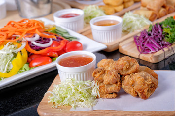 Close up chicken nuggets with sweet and chili sauce