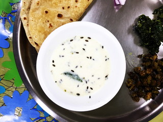  indian gujarati traditional dish with kadhi curry patta chapati fry bhindi masala