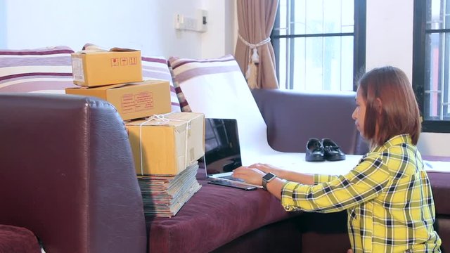 Women working laptop computer from home with postal parcel, Selling online ideas concept