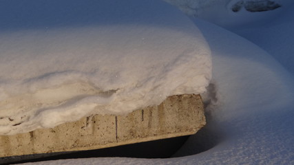 Reinforced concrete products covered with snow.