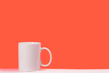Cup white coffee on colored background with space for text