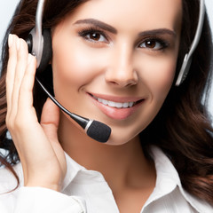 Portrait of smiling support female phone operator in headset