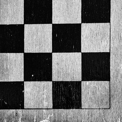 Corner of worn wooden checkkerboard