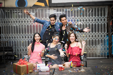 Happy people with gift box surprise in the party