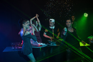 Fototapeta na wymiar Party young people group dancing in night club