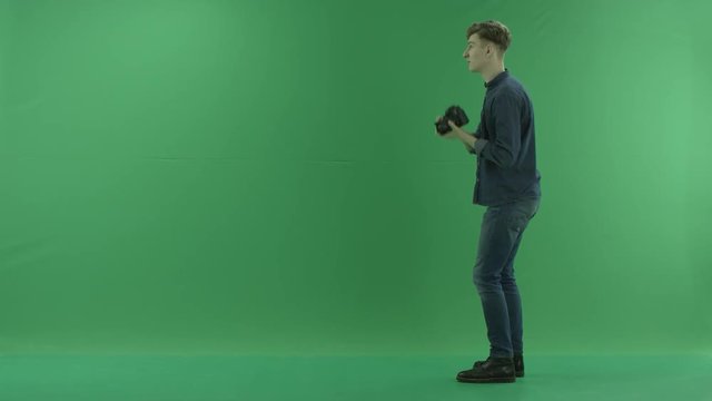 Photographer taking photos on the left hand side around myself on the green screen