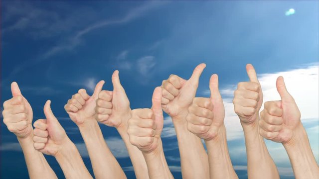 Crowd people showing thumb up on clear sky background