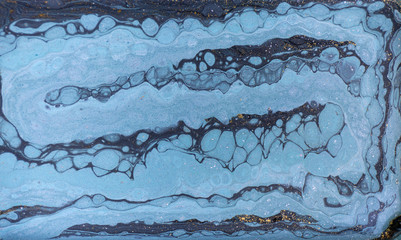 Marble abstract acrylic background. Nature blue marbling artwork texture. Gold glitter.