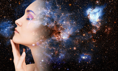 Abstract image of woman face and cosmic galaxy.