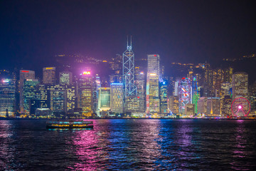 Fototapeta na wymiar View of Cityscape at night time, Victoria Harbor Island, Hong Kong