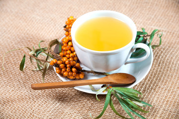 Sea buckthorn tea with a on white background