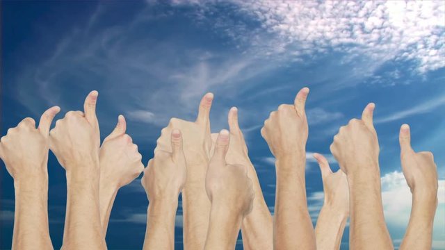 Crowd group simultaneously raising thumb up on blue sky background