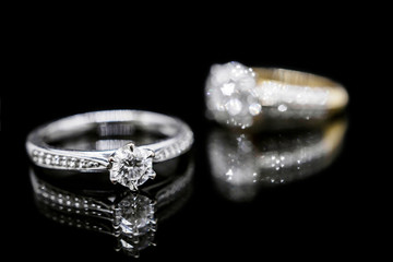Close up Jewelry diamond ring on black background with reflection