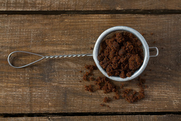 molasses sugar on wooden surface