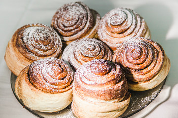  ruddy buns sprinkled with powdered sugar