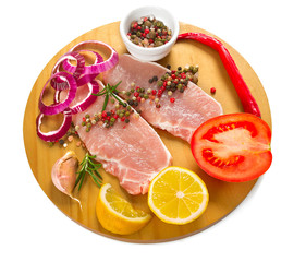 sliced raw meat and vegetables isolated on white