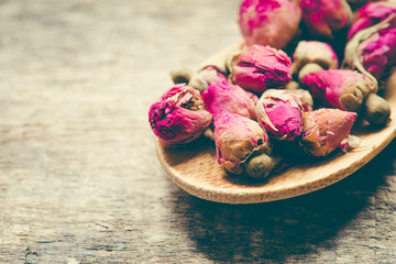 dried flowers  rose on wooden background