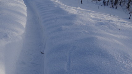 The texture of snow in the light of the rising sun.