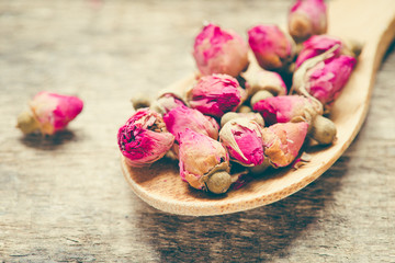 dried flowers  rose on wooden background