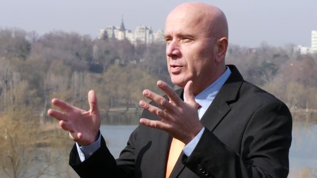 Businessman Speaking Financial Issues Talking and Explaining Gesturing