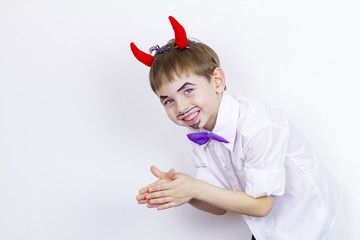 Cheerful Boy with red horns April fool's day.